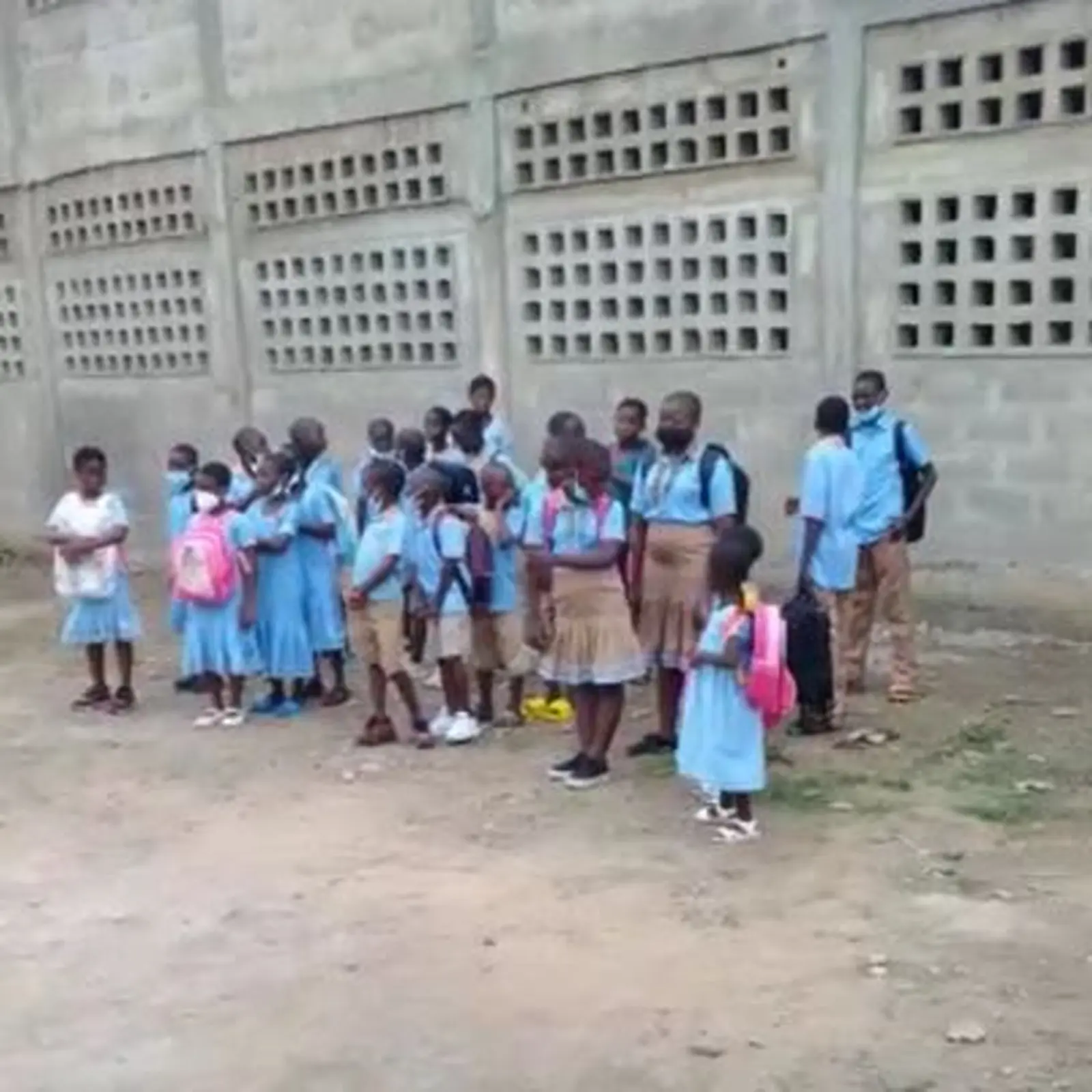 Students gathered outside their school