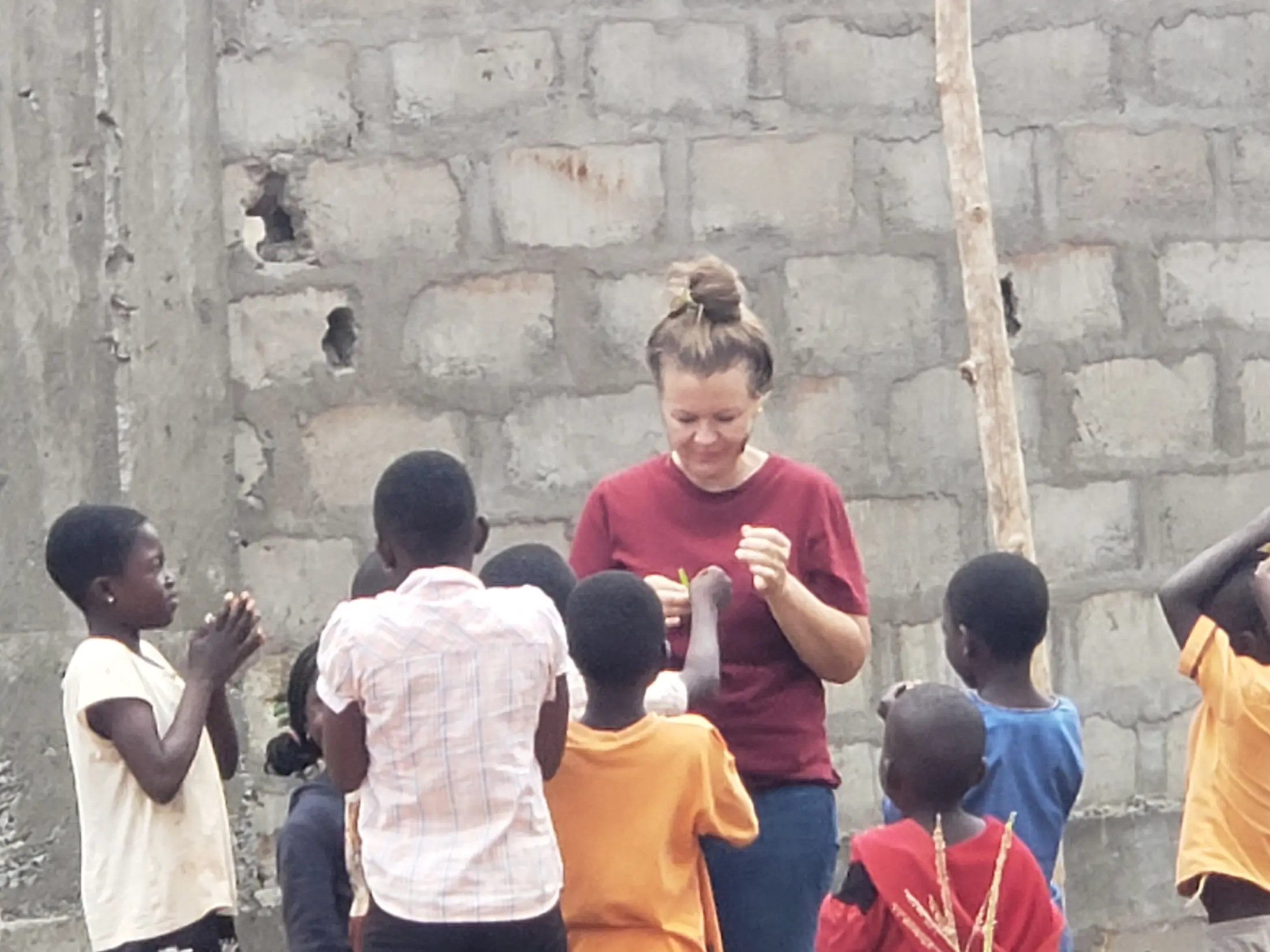 A volunteer spending time with children in the community